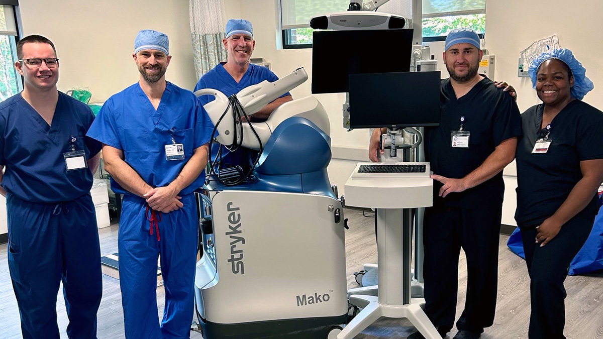 Virtua formed partnerships in 2006 with Summit Surgical Center in Voorhees and Vantage Surgical Center in Moorestown. A group of surgeons is pictured standing with surgical equipment.