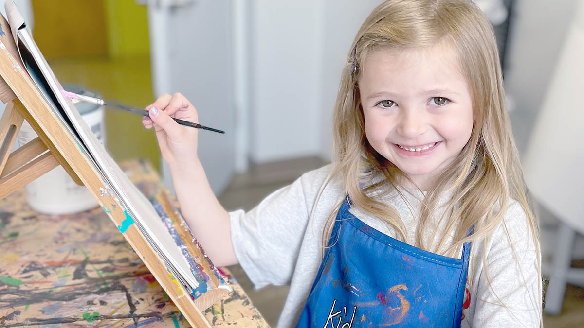Young girl painting as part of the CASTLE Behavioral Health program, circa 1999