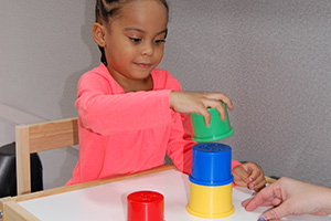 Pediatric Mobile Services child playing with blocks