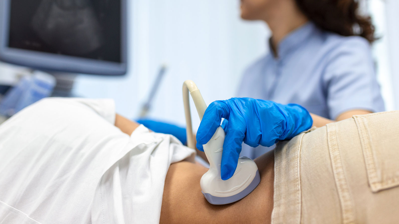 woman receiving an ultrasound of her kidneys