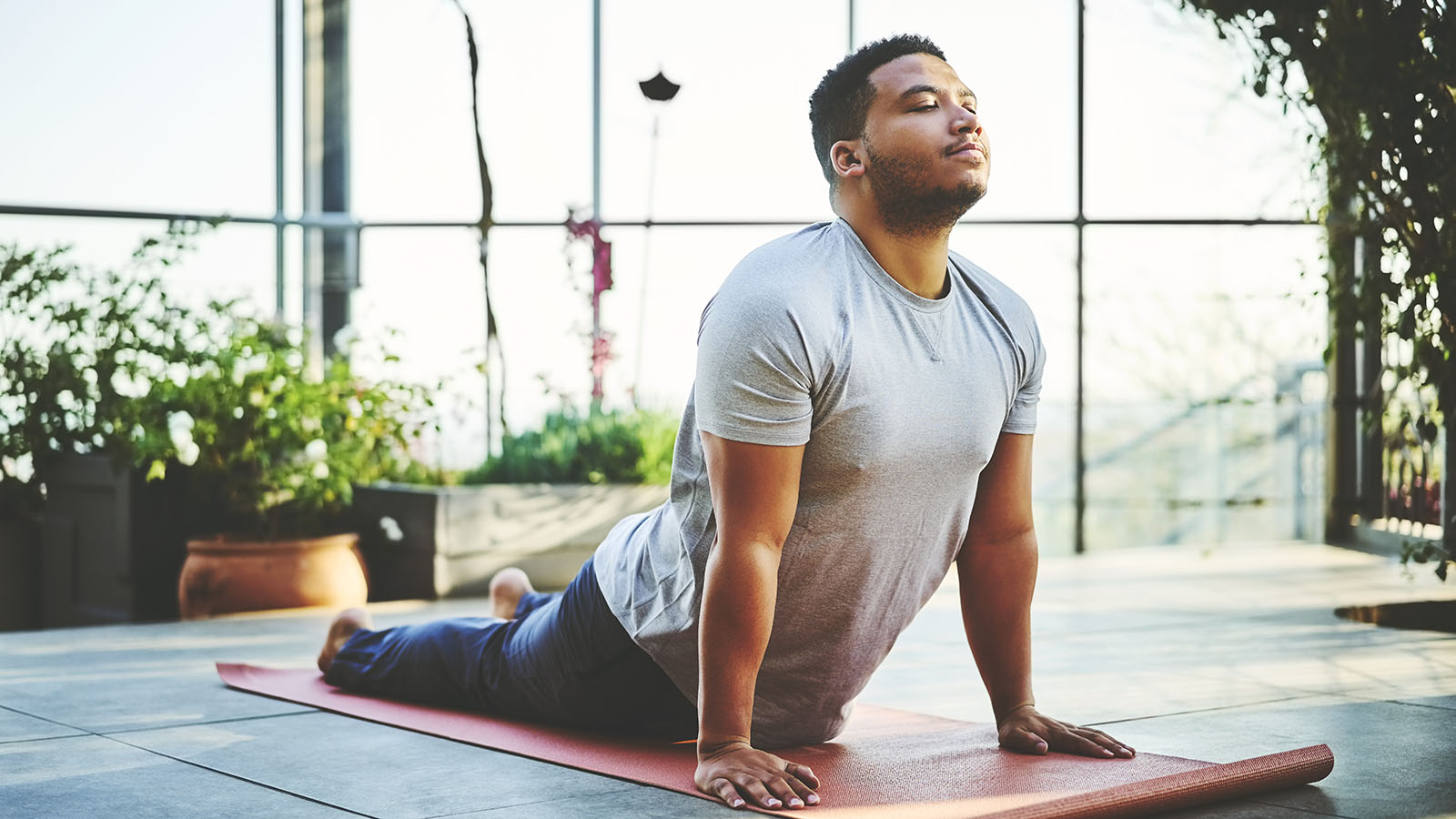 Adult man practicing yoga and meditating
