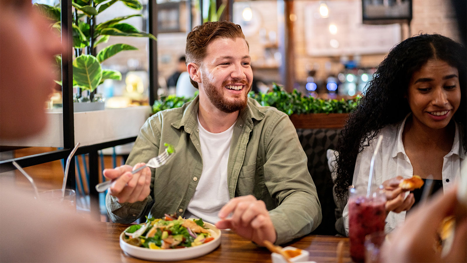 friends eating a healthy meal out together