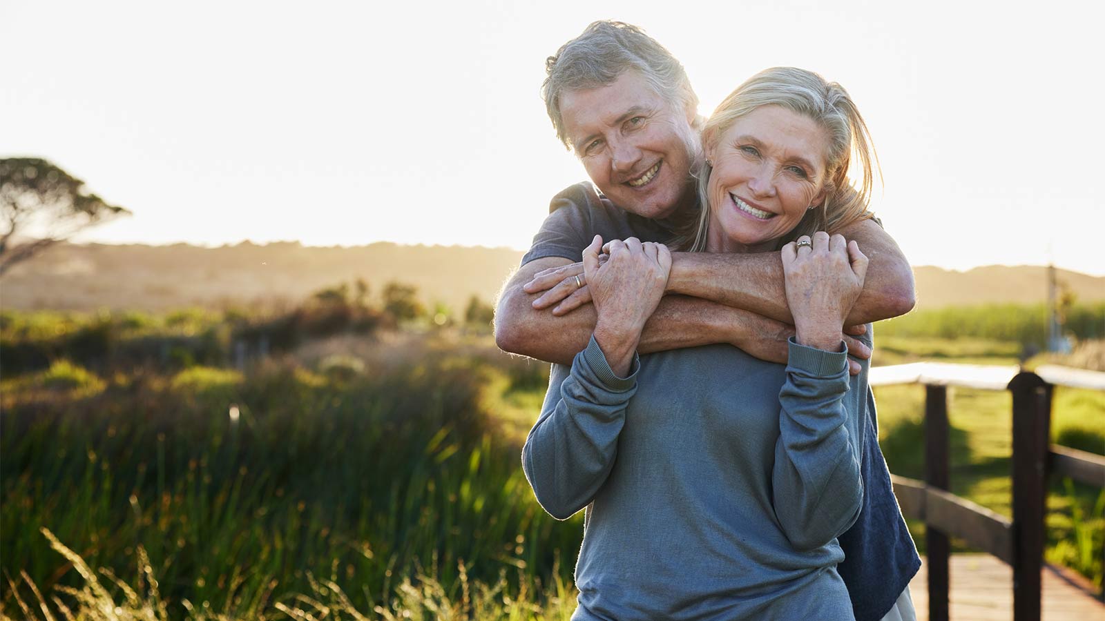 middle aged couple embracing outside