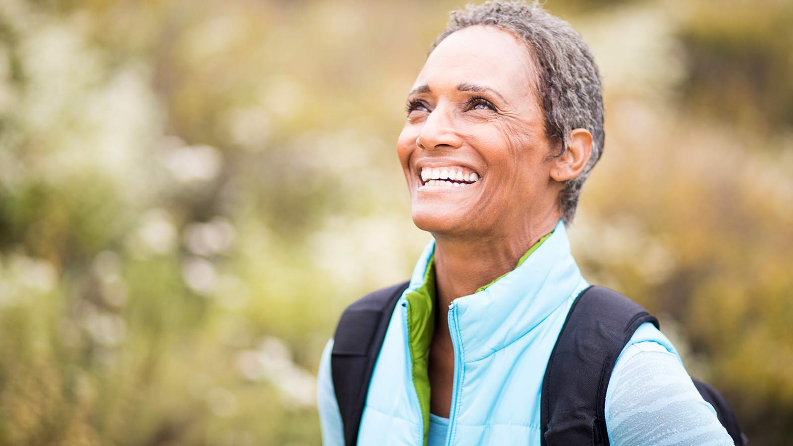 middle aged women smiling and walking outdoors