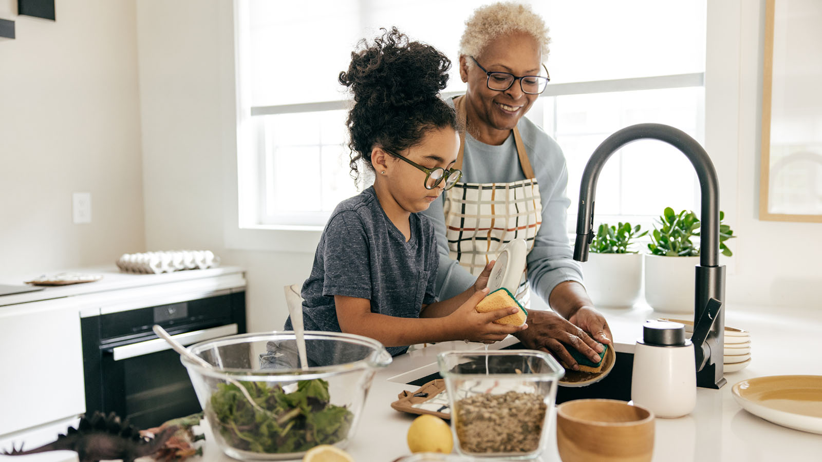 Grandmother and granddaughter preparing a healthy meal together