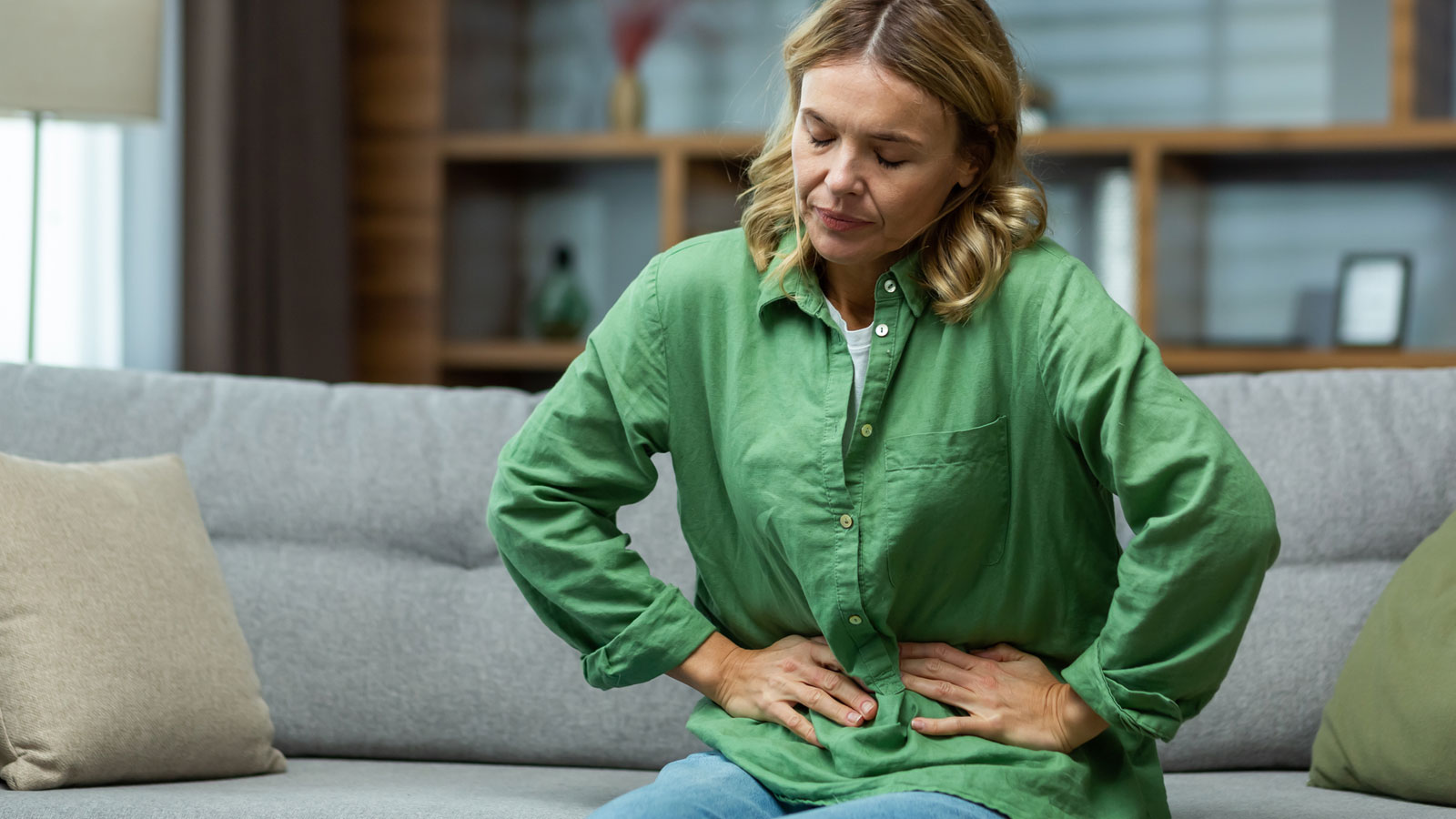 woman experiencing stomach pains 