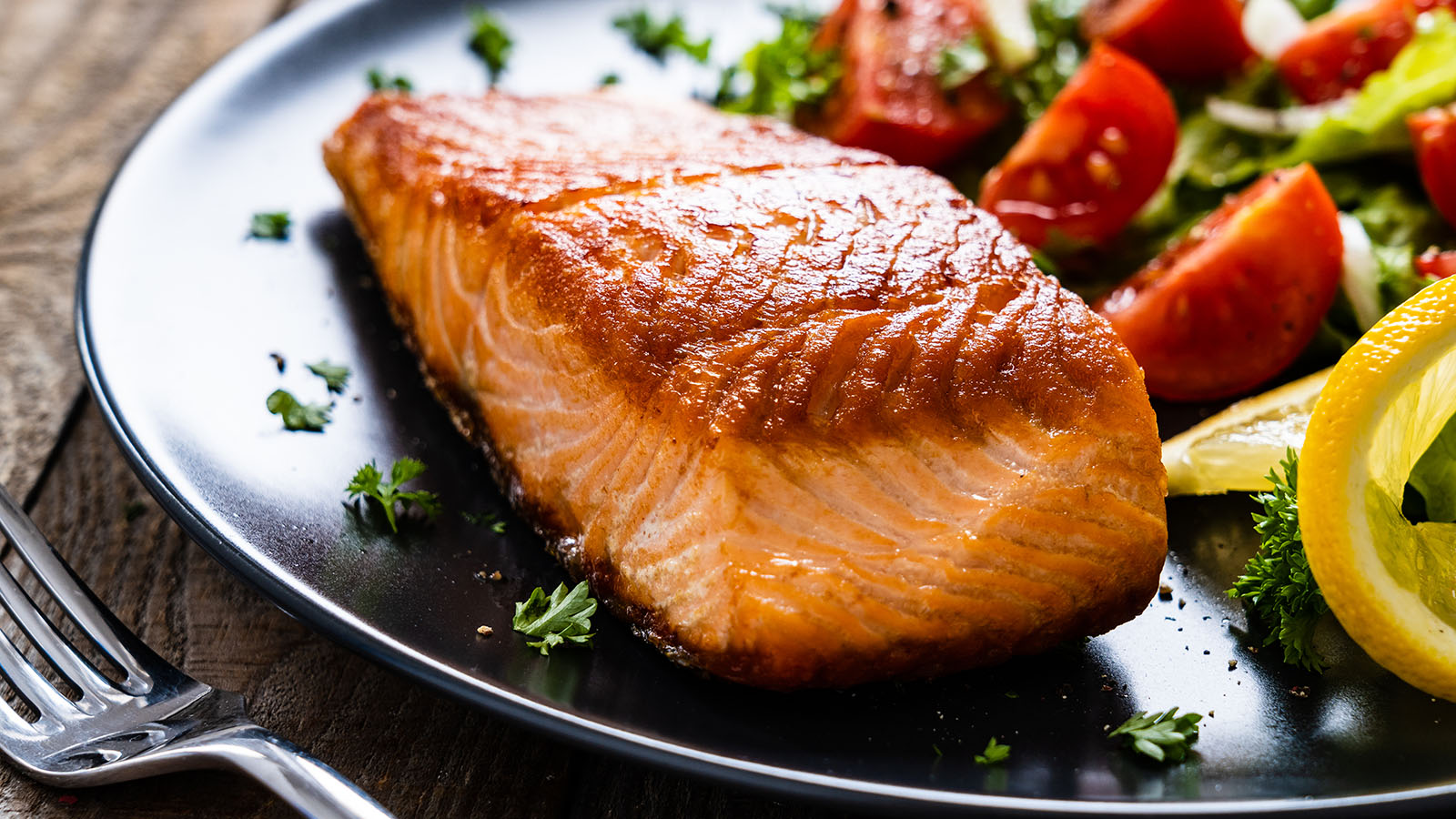 seared salmon and vegetables on a plate