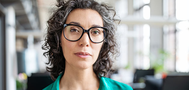 woman with glasses in hospital lobby