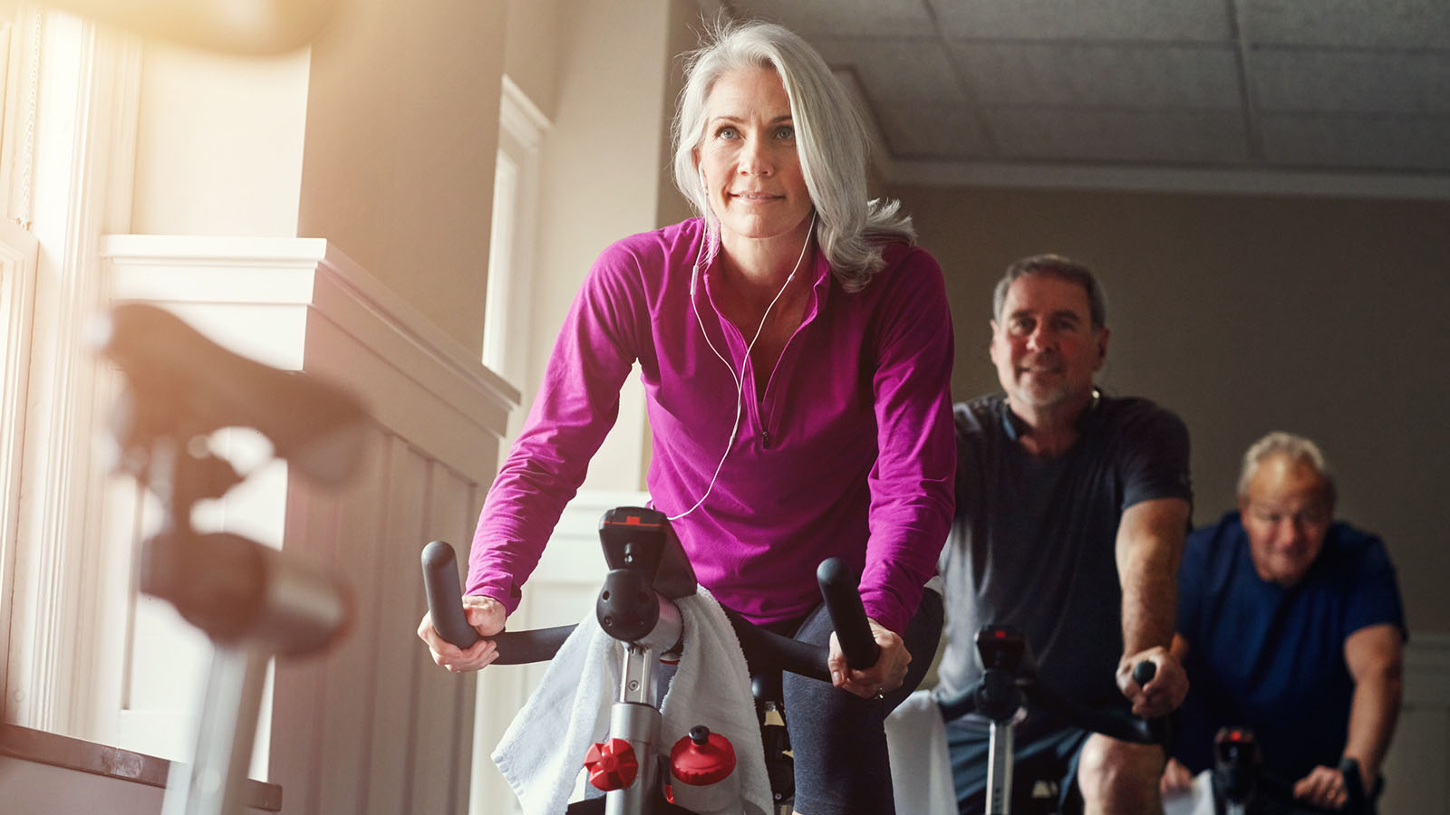 Older woman in a cycling class