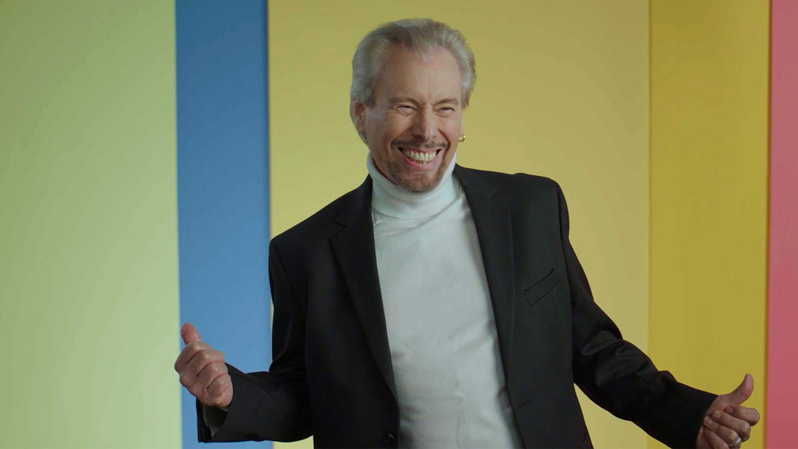 man smiling at the camera and dancing