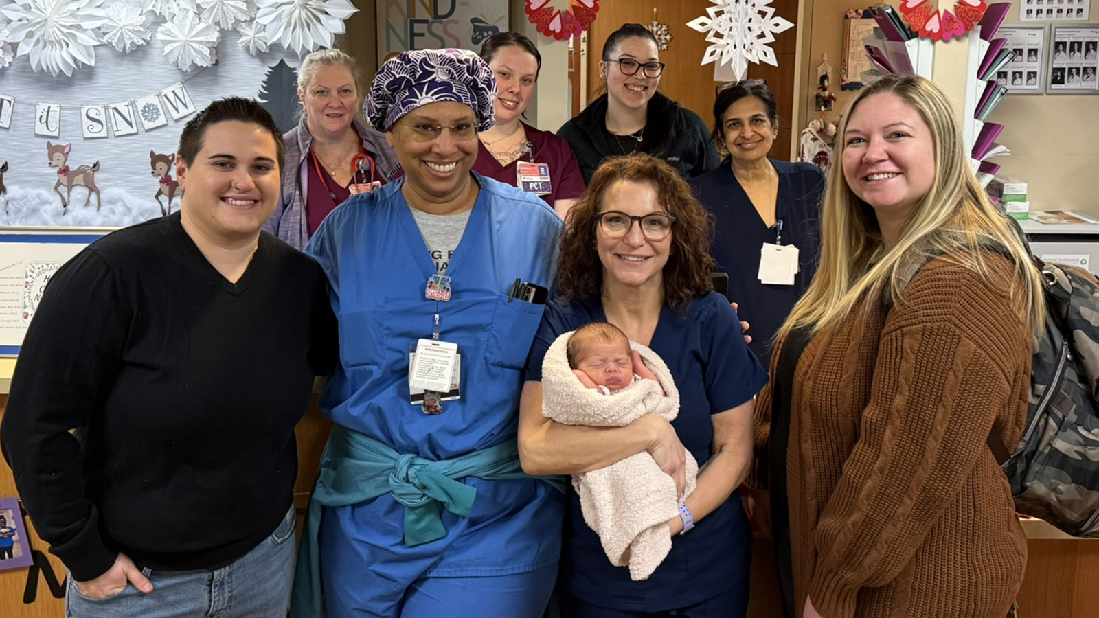 Harley Earley and her family pose with members of the Maternity Team at Virtua Mount Holly Hospital