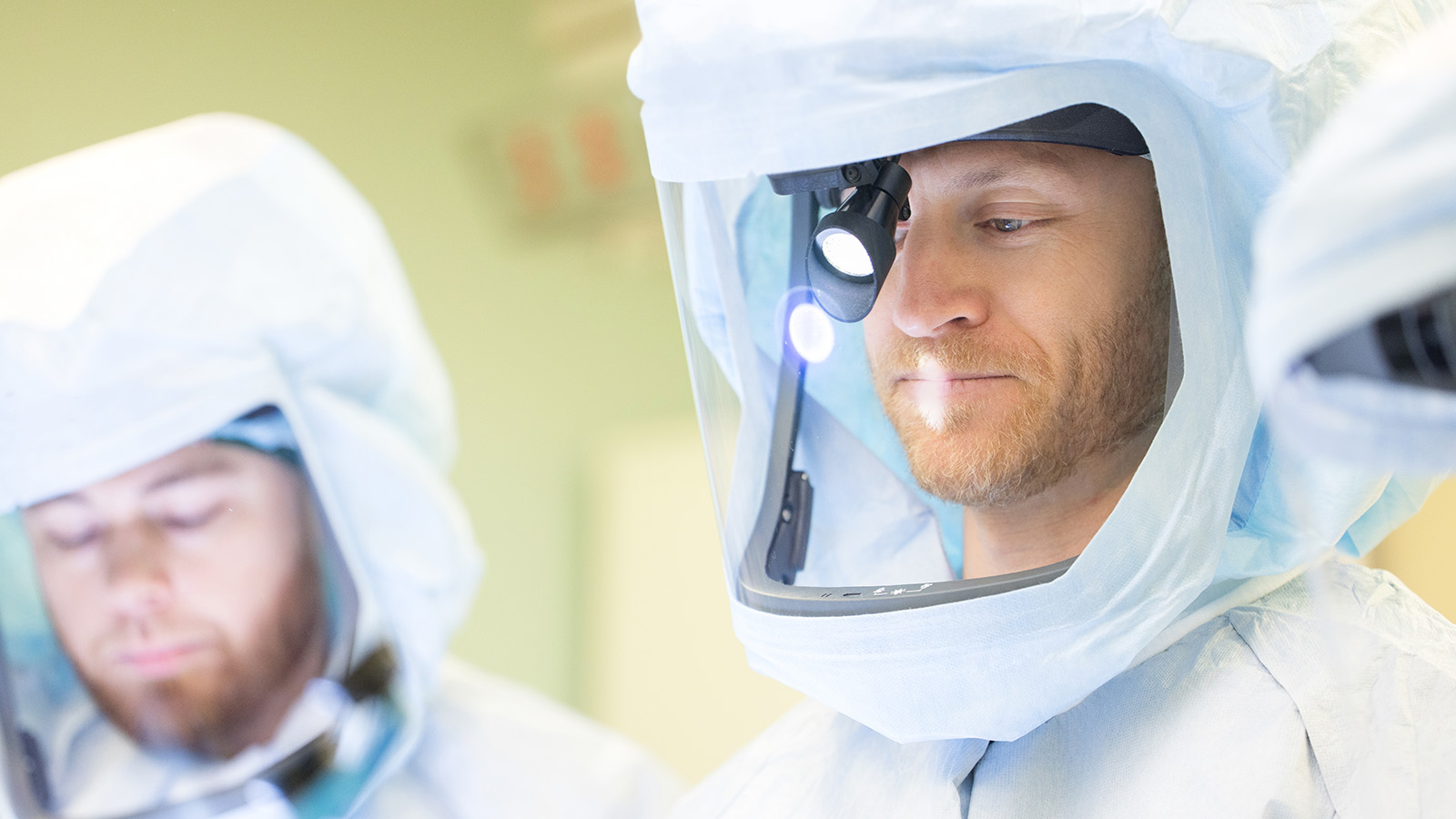 two orthopedic surgeons in surgical gear