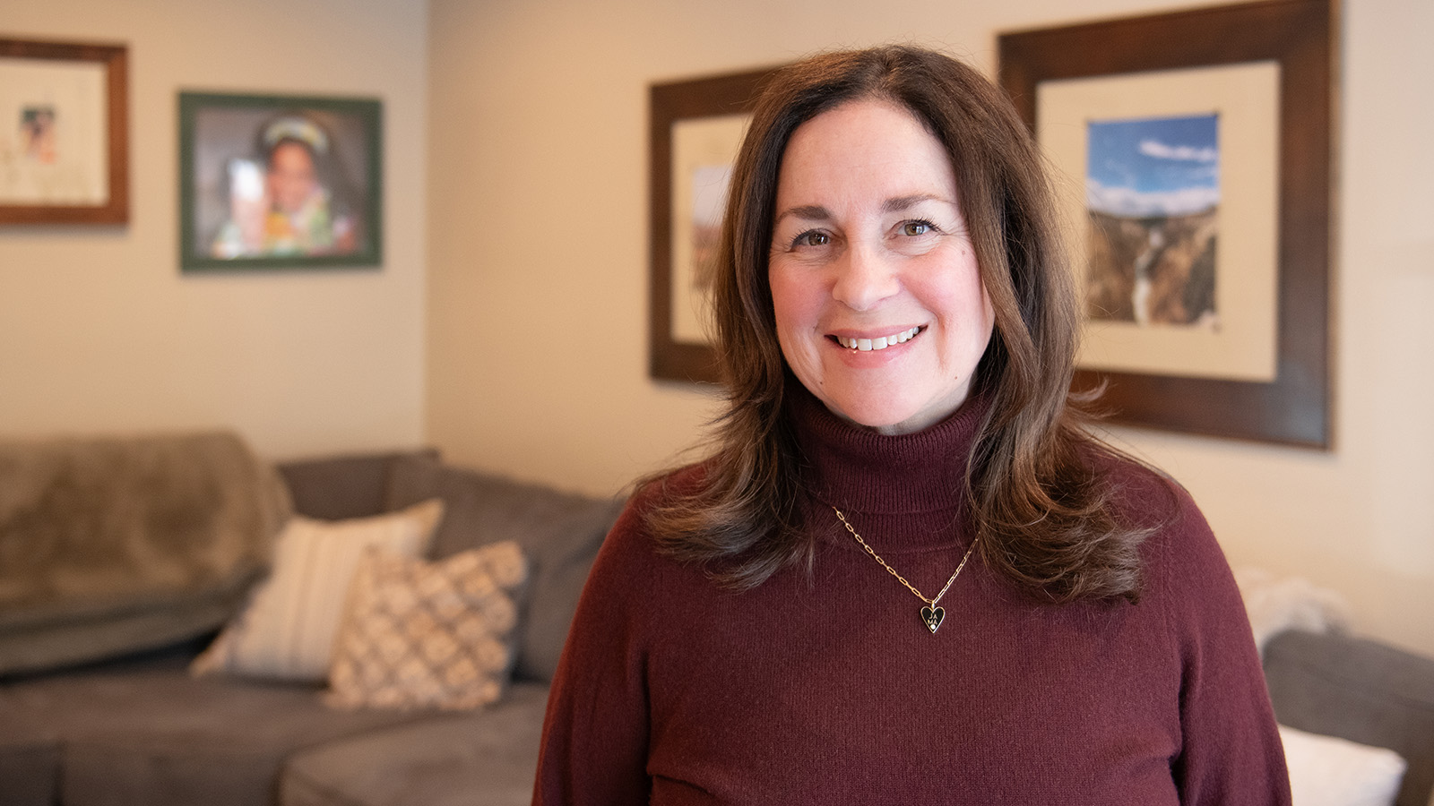 Virtua female patient who had robotic hip surgery is pictured in her living room