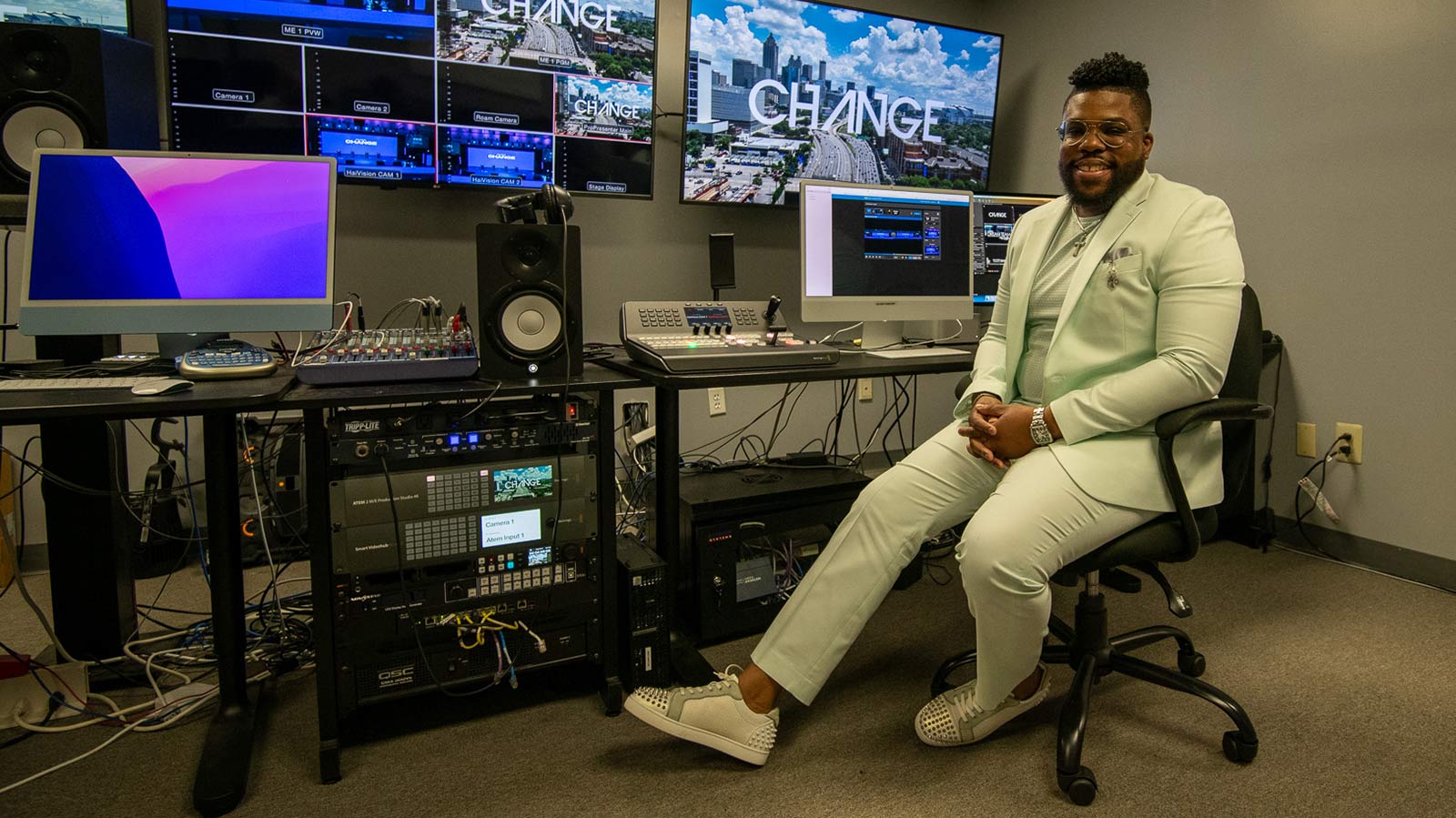 Virtua heart patient Justin surrounded by audio equipment