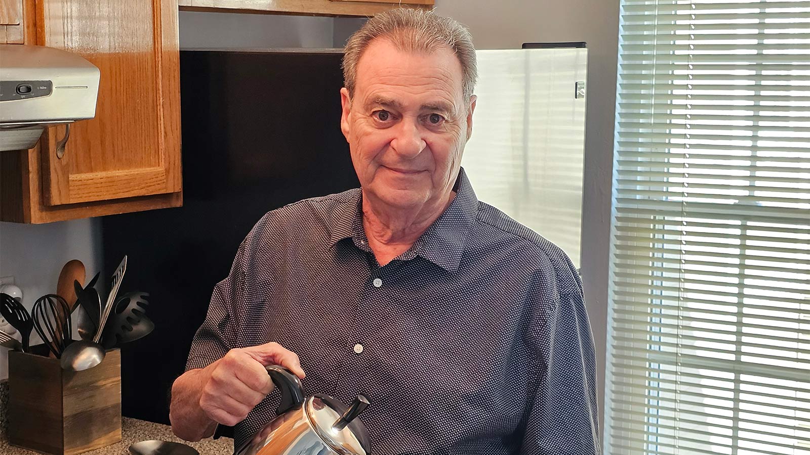 man making coffee at home in his kitchen