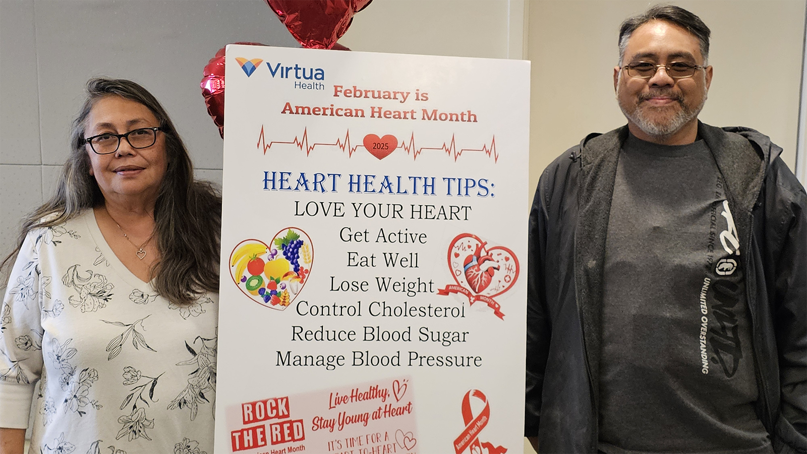 LVAD patient Michael and his sister pose with a February is Heart Month sign at Virtua Health