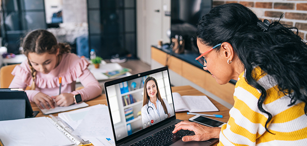 Woman talking to doctor via computer