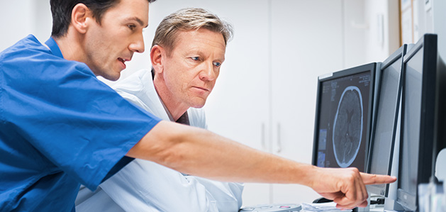 Doctors looking at brain scan