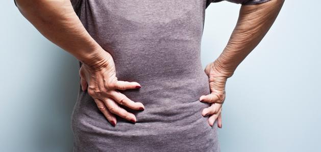 Person with hands on their back