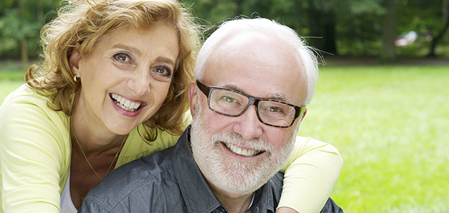 Two people smiling in a park