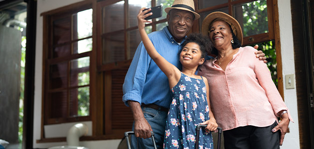 Family taking a selfie in-front of a building