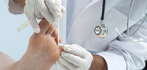 Doctor examining foot