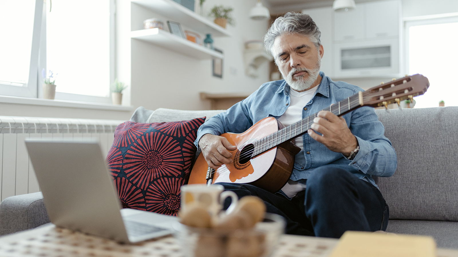 A man playing guitar.