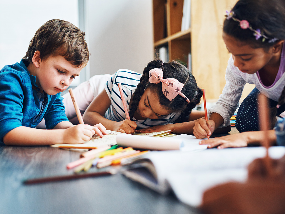 Young children work on homework together