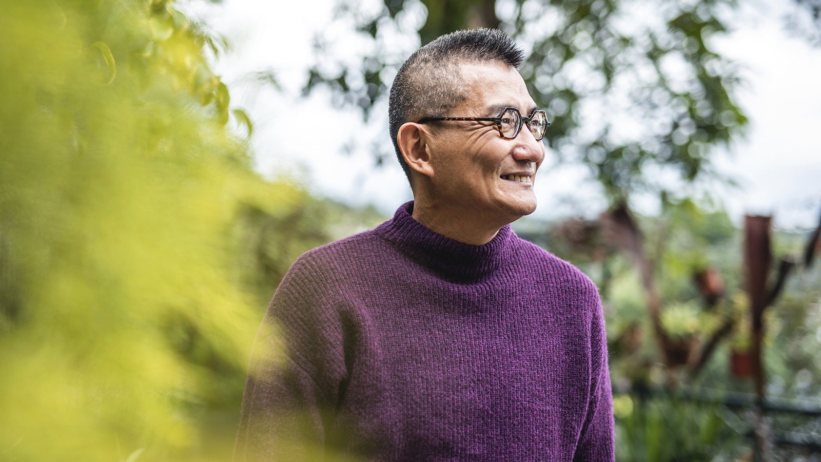 A man smiling outside.