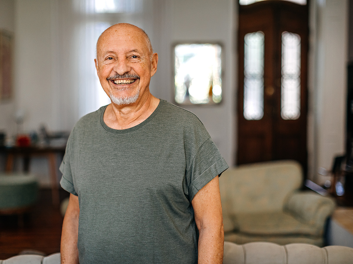 Portrait of smiling senior man in retirement home